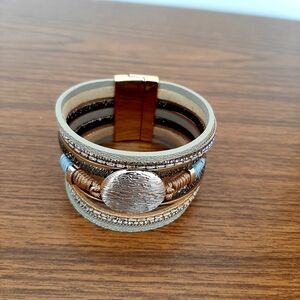 Elegant Multi-Layered Bracelet with Gold and Silver Accents